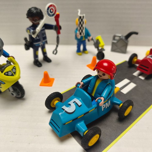 Playmobil race track like new with motorcycle, 2 cars, 3 figures, police officer