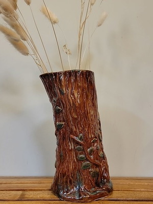 Handmade ceramic vase with natural decorative elements