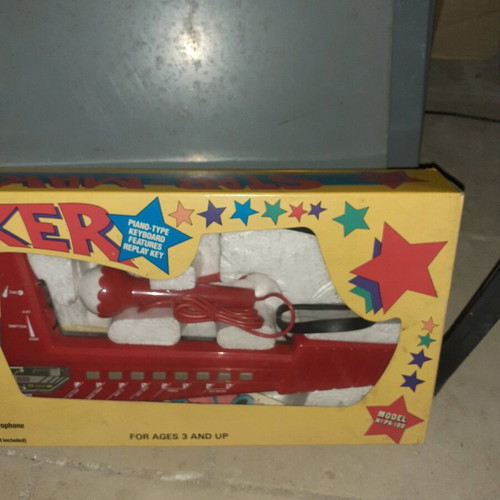 Old piano toy in red color new