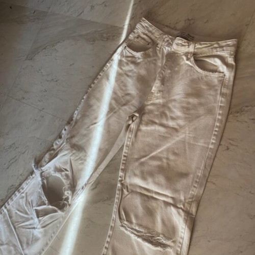 Stradivarius white wide leg jeans with knee rips