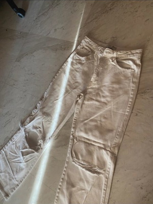 Stradivarius white wide leg jeans with knee rips