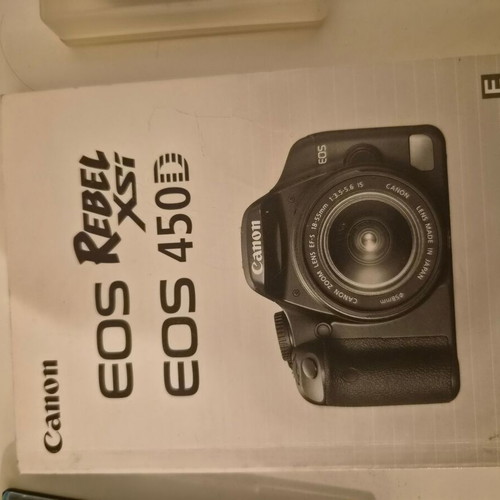 Canon EOS 450D camera used with 17-85mm zoom lens and accessories