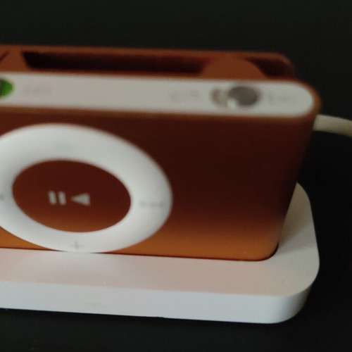 Apple iPod Shuffle 2nd Gen orange with dock, cable and headphones used