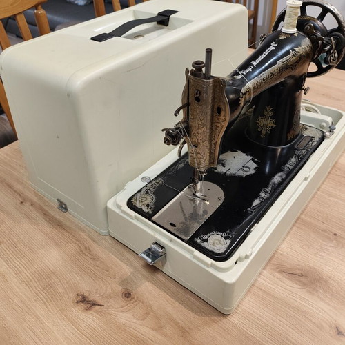 Singer vintage sewing machine with motor and case