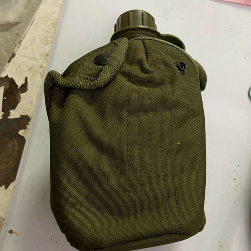 Military backpack M71 used with waterproof cover and ES canteen