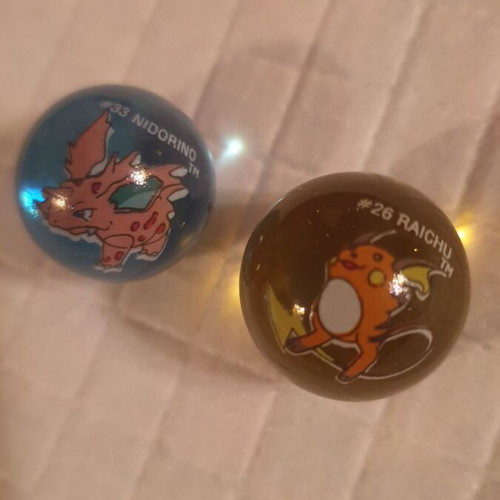 Raichu & Nidorino marbles like new, collectible
