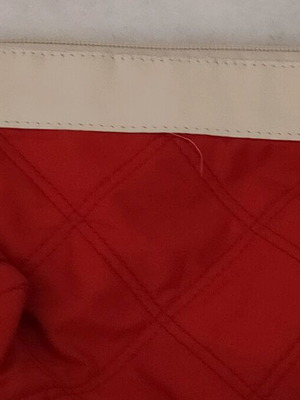 Toiletry bag used red with white stripe