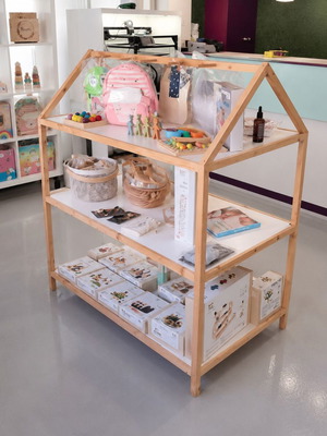 Wooden house-shaped display shelf for store