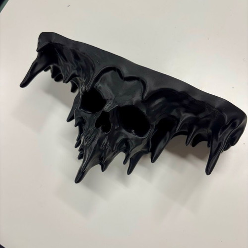 Wall shelf new with melted skull design for style