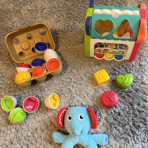 Baby toys set like new with shape matching eggs, house, and rattle gift