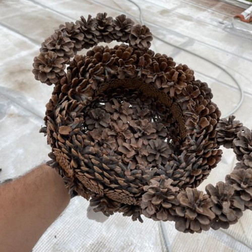 Decorative basket used made of pine cones