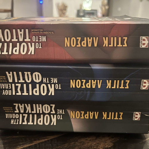 Millennium Trilogy by Stieg Larsson used, first book yellowed