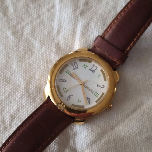 Benetton unisex watch like new, gold color