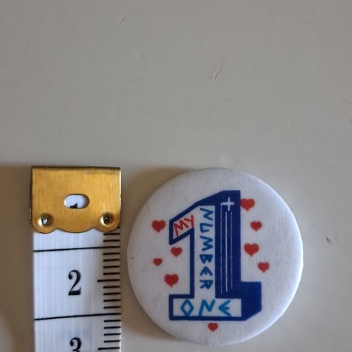 Vintage round pins set with Betty Boop and My Number One, like new