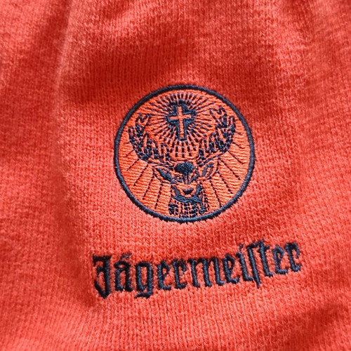 Jägermeister orange ear-flap beanie with pom-pom used like new