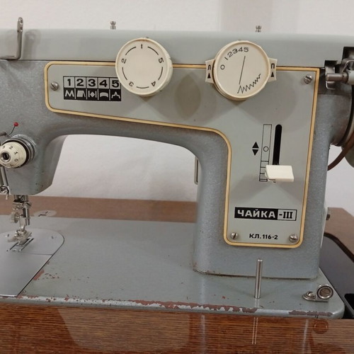 Russian Chaika Sewing Machine used with cabinet and accessories
