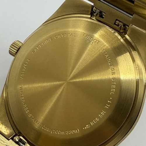 Tissot PRX Quartz watch with golden dial