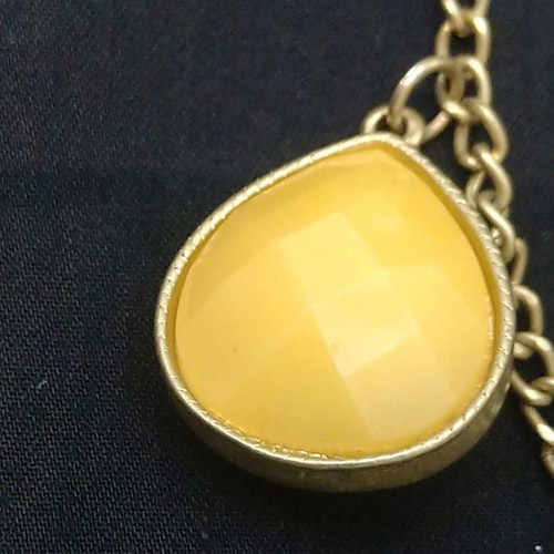 Double long necklace with matte gold chain and beige decorations