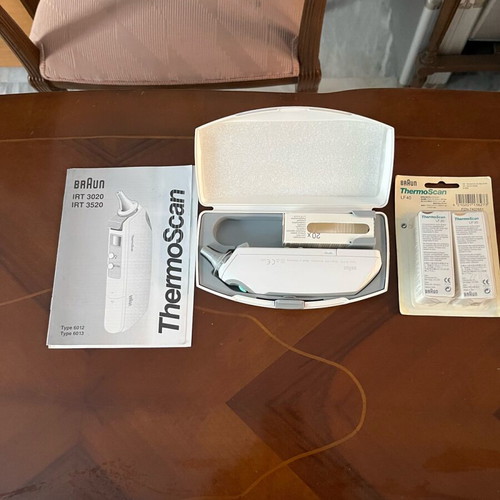 Brown electronic ear thermometer new with two sets of covers