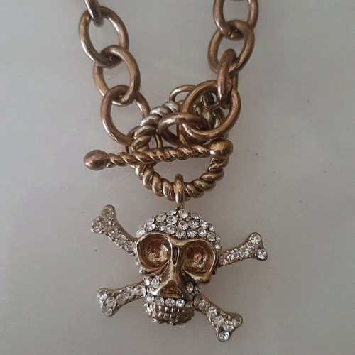 Necklace used pink gold color with skull design