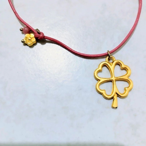 Four-leaf clover charm necklace with coral leather