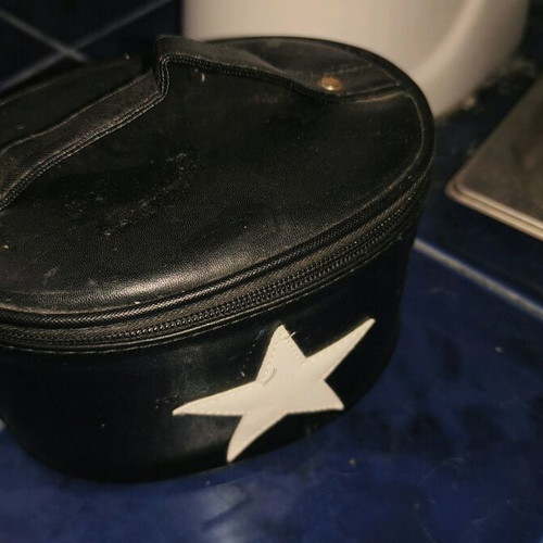 Black toiletry bag like new with zipper and star design