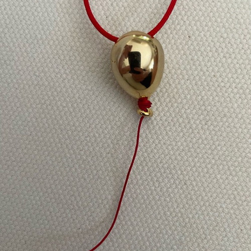 Kessaris necklace used with gold-plated balloon-shaped pendant