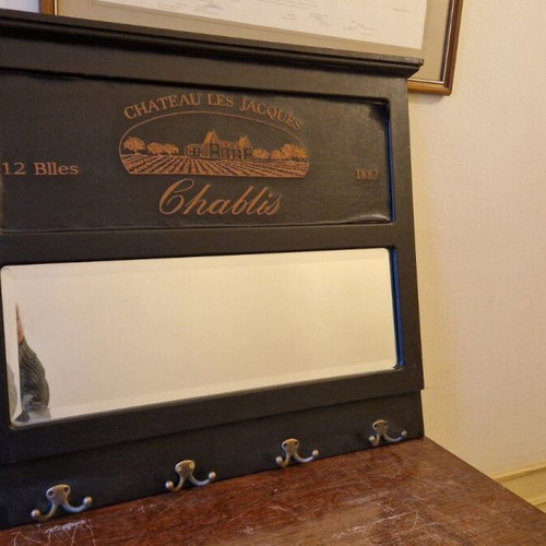 Vintage entry mirror used with coat hooks