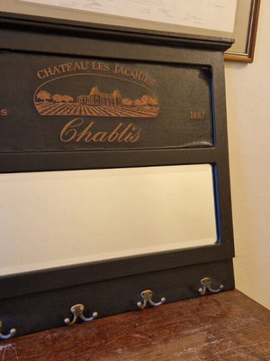 Vintage entry mirror used with coat hooks