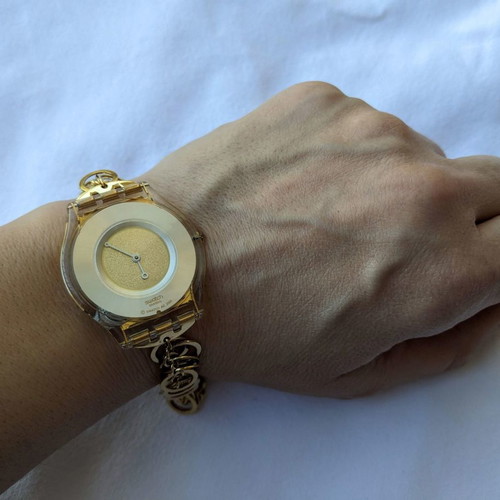 Swatch women's watch used with gold chain strap