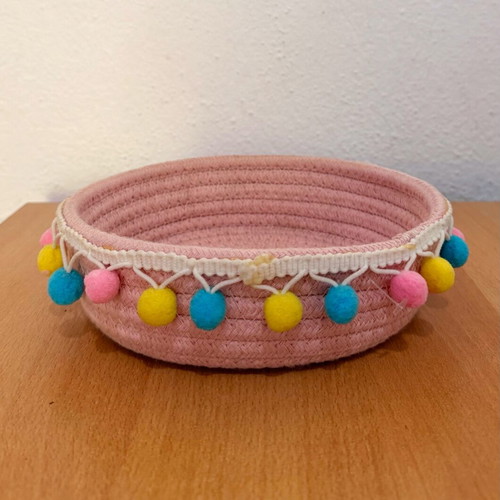 Handmade pink basket with colorful pom poms like new