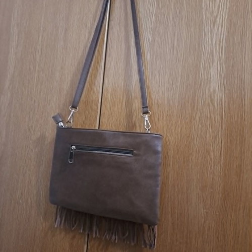 Brown synthetic suede crossbody bag with fringes and metal studs, boho style