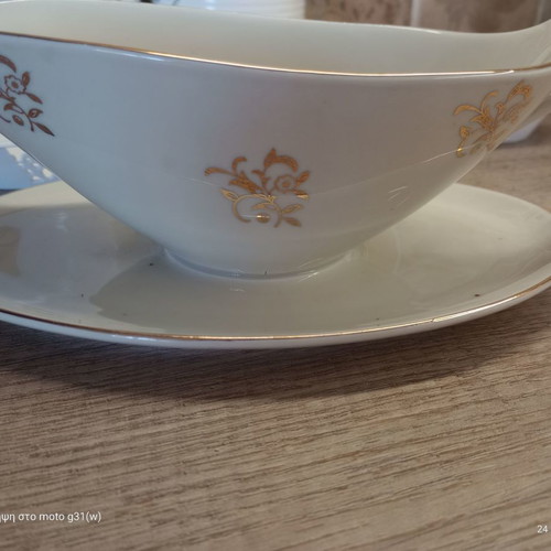 Gravy boat and deep plate used with floral patterns