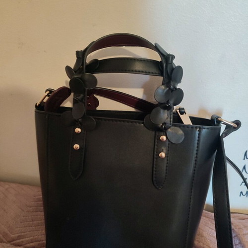 Vintage leather black bag used with flowers and burgundy interior