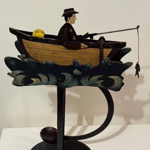 Vintage style folk art pendulum with fisherman in boat used