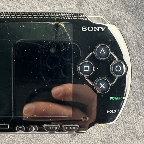PlayStation Portable PSP-1000 used with charger, 5 games, and Memory Stick