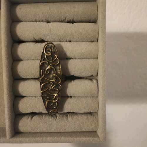 Ring with embossed designs adjustable size, like new