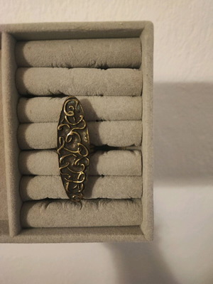 Ring with embossed designs adjustable size, like new