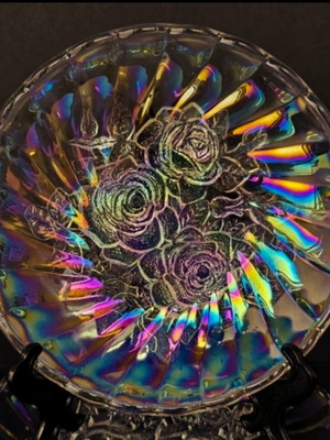Vintage iridescent glass plate with embossed rose design