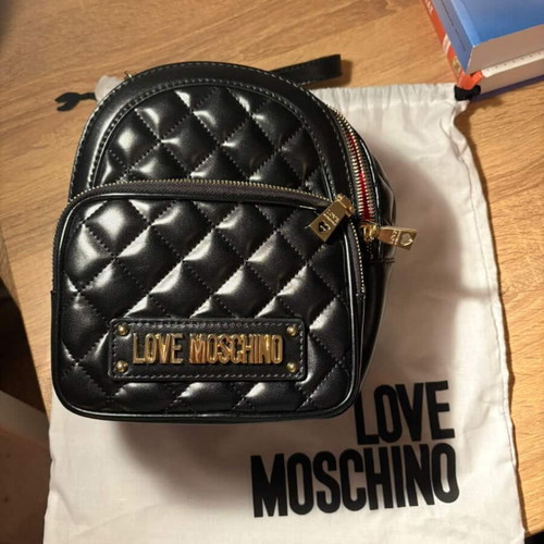 Love Moschino small black backpack like new with gold details