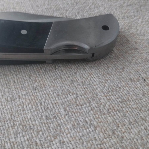 Metal folding knife with stainless blade like new