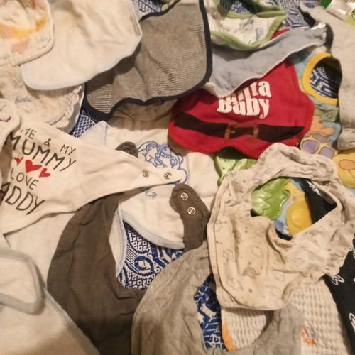 Baby bibs used, pack of 27, assorted colors and patterns