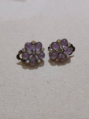 Earrings used with clip missing one rhinestone