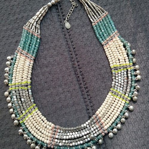Accessorize multistrand necklace with plastic and glass beads