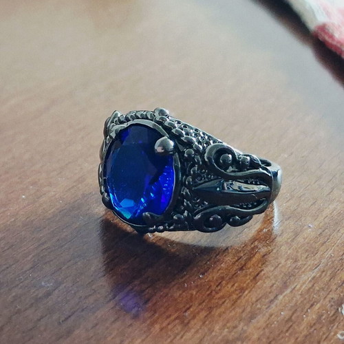 Ring with blue sapphire new, black rhodium plating