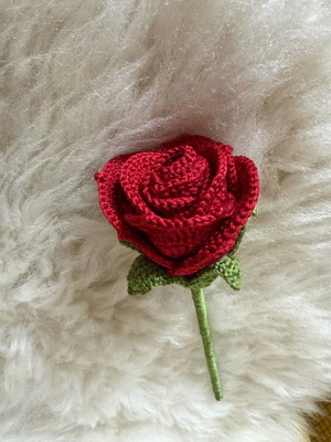 Knitted rose new, timeless symbol of love