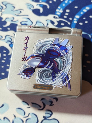 Silver Gameboy Advance SP shell with embossed Kyogre UV print