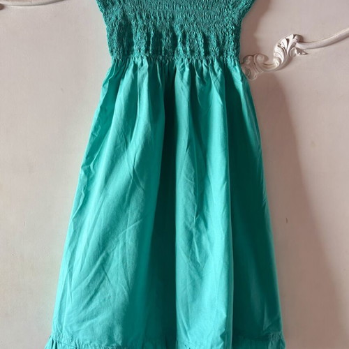 Strapless dress turquoise used with smocked bust