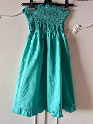Strapless dress turquoise used with smocked bust
