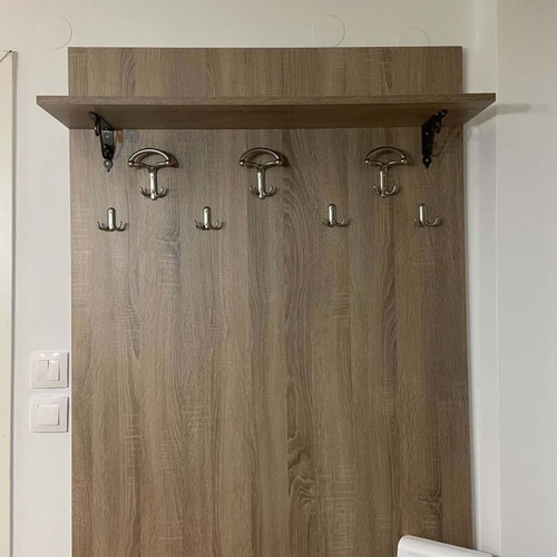Wall coat rack like new with dimensions 0.97W x 1.36H